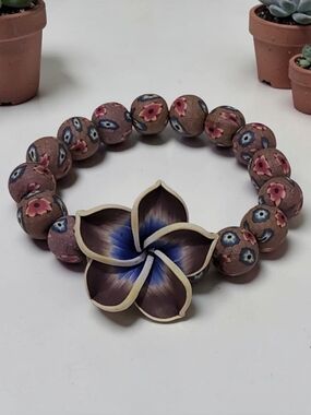 10/ $10 New  Pink Floral Bead Bracelet with Blue Flower Accent